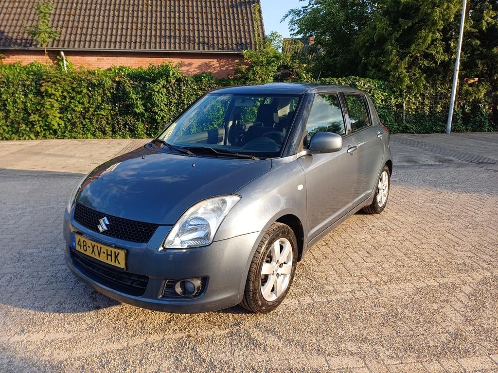 Suzuki Swift 1.3 5DRS 2007 Grijs, Auto's, Voorwielaandrijving, Stof, 40 €/maand, Elektrische ramen