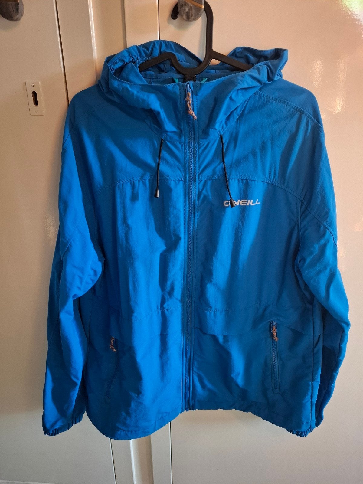 O'Neill Blauwe Windjack/Jas - Maat XS, Kleding | Dames, Jassen | Zomer, Gedragen, Verzenden, Blauw, Maat 34 (XS) of kleiner