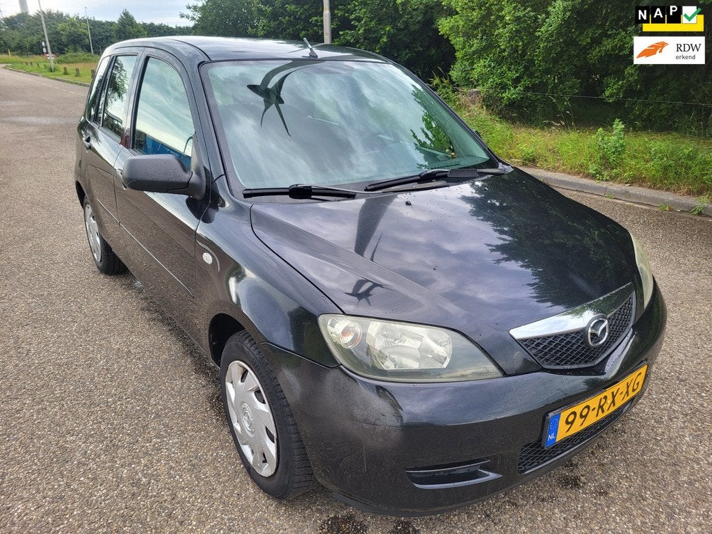 Mazda 2 APK 22-1-27 2005 1.4 Exclusive 950,-, Auto's, Mazda, Voorwielaandrijving, 1025 kg, 4 cilinders, Zwart