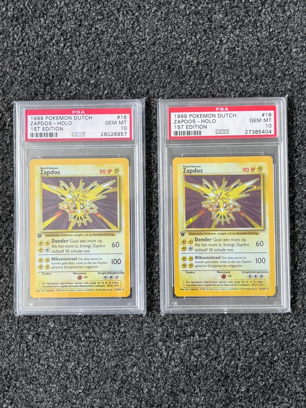 Pokémon 2x PSA 10 Dutch 1st Ed. Zapdos Holo Base set (POP 9), Ophalen of Verzenden, Zo goed als nieuw, Meerdere kaarten, Foil