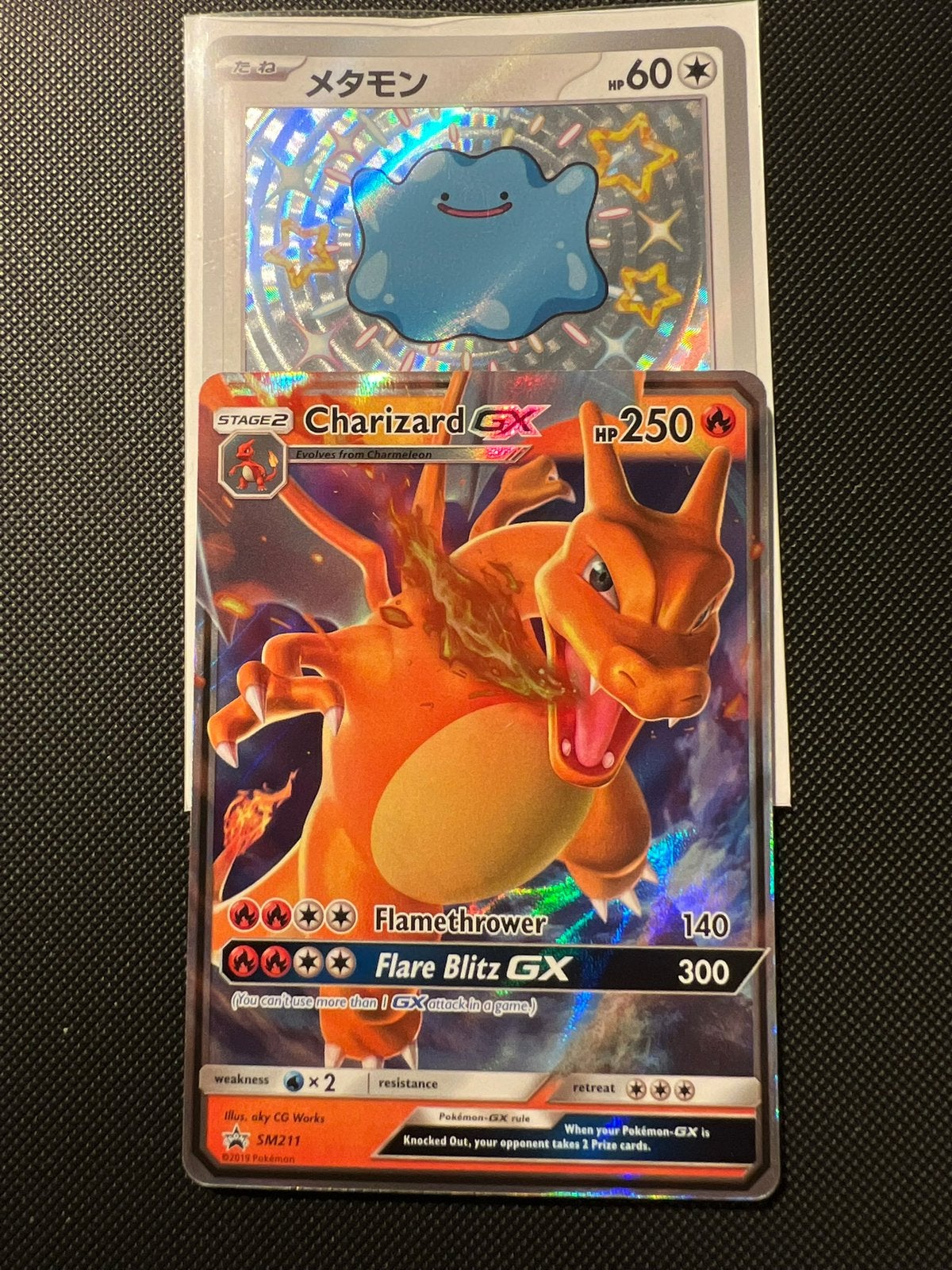 Charizard GX SM211, Ophalen of Verzenden, Zo goed als nieuw, Losse kaart, Foil