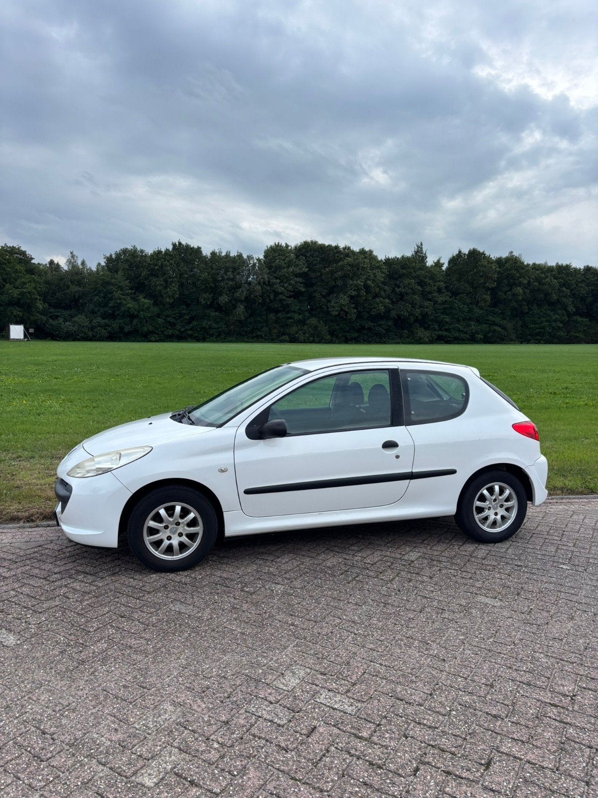 Peugeot 206+ 1.1 3D 2010 Wit, Auto's, Voorwielaandrijving, 206+, 31 €/maand, 4 cilinders