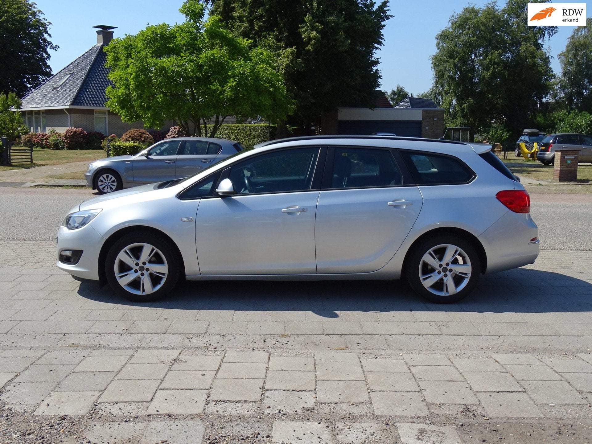 Opel Astra Sports Tourer 1.4 Turbo Cosmo, Auto's, Voorwielaandrijving, Euro 5, Gebruikt, 4 cilinders