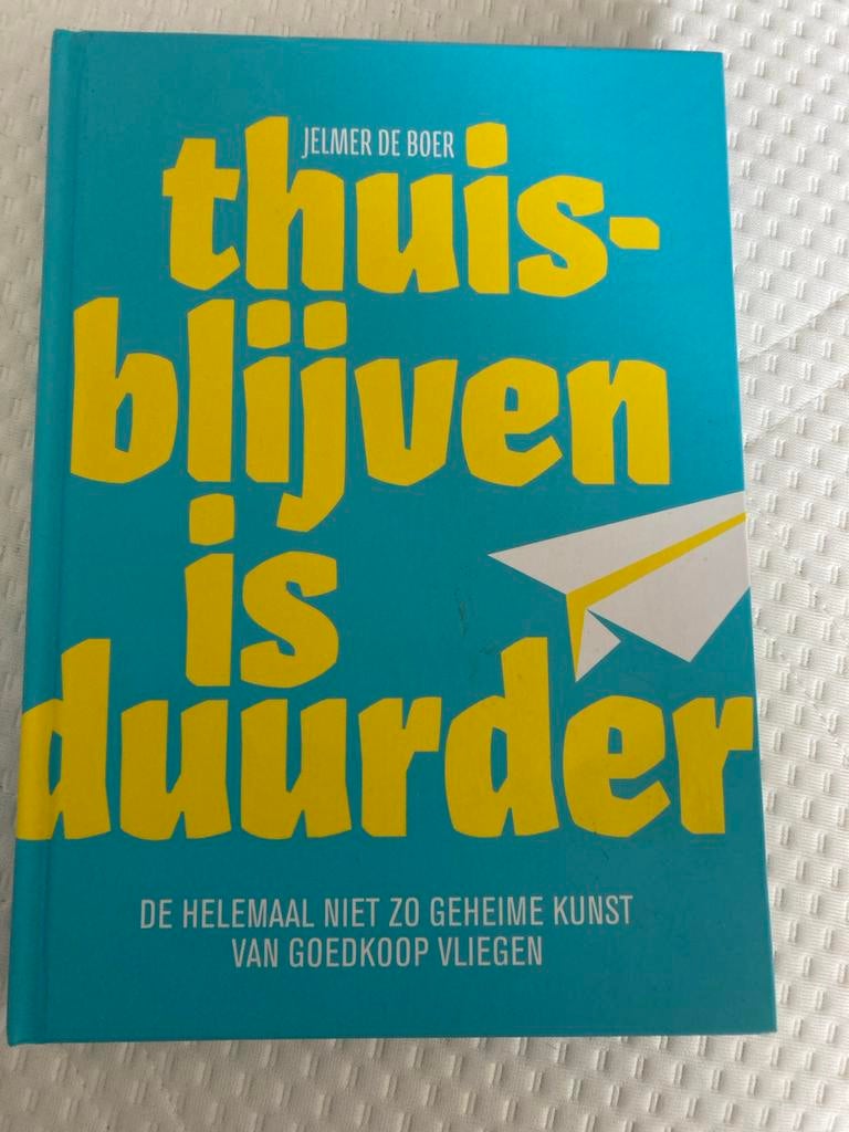 Thuisblijven is duurder - De kunst van goedkoop vliegen, Ophalen of Verzenden, Zo goed als nieuw, Reisgids of -boek
