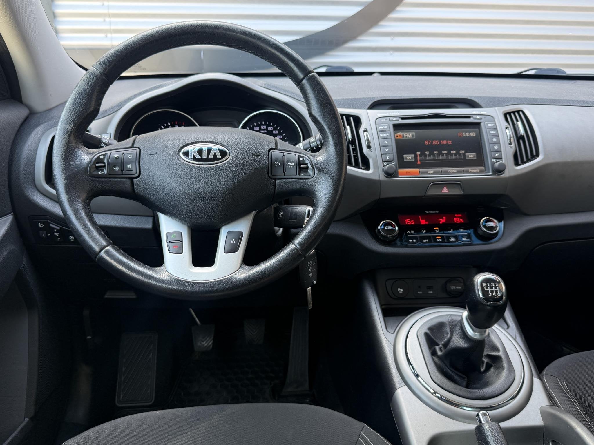 Kia Sportage 1.6 GDI BusinessLine 1e Eigenaar|Navi|Camera|Cl, Auto's, Voorwielaandrijving, Euro 5, 1591 cc, Zwart
