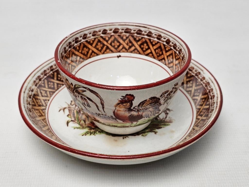 # Petrus Regout kop en schotel - Haan decor, Antiek en Kunst, Antiek | Servies los, Ophalen of Verzenden