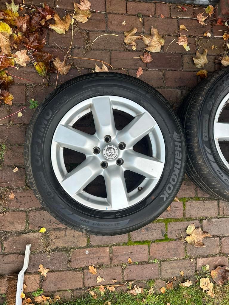 Nissan lichtmetalen velgen met Hankook Optimo K415-banden, Ophalen of Verzenden
