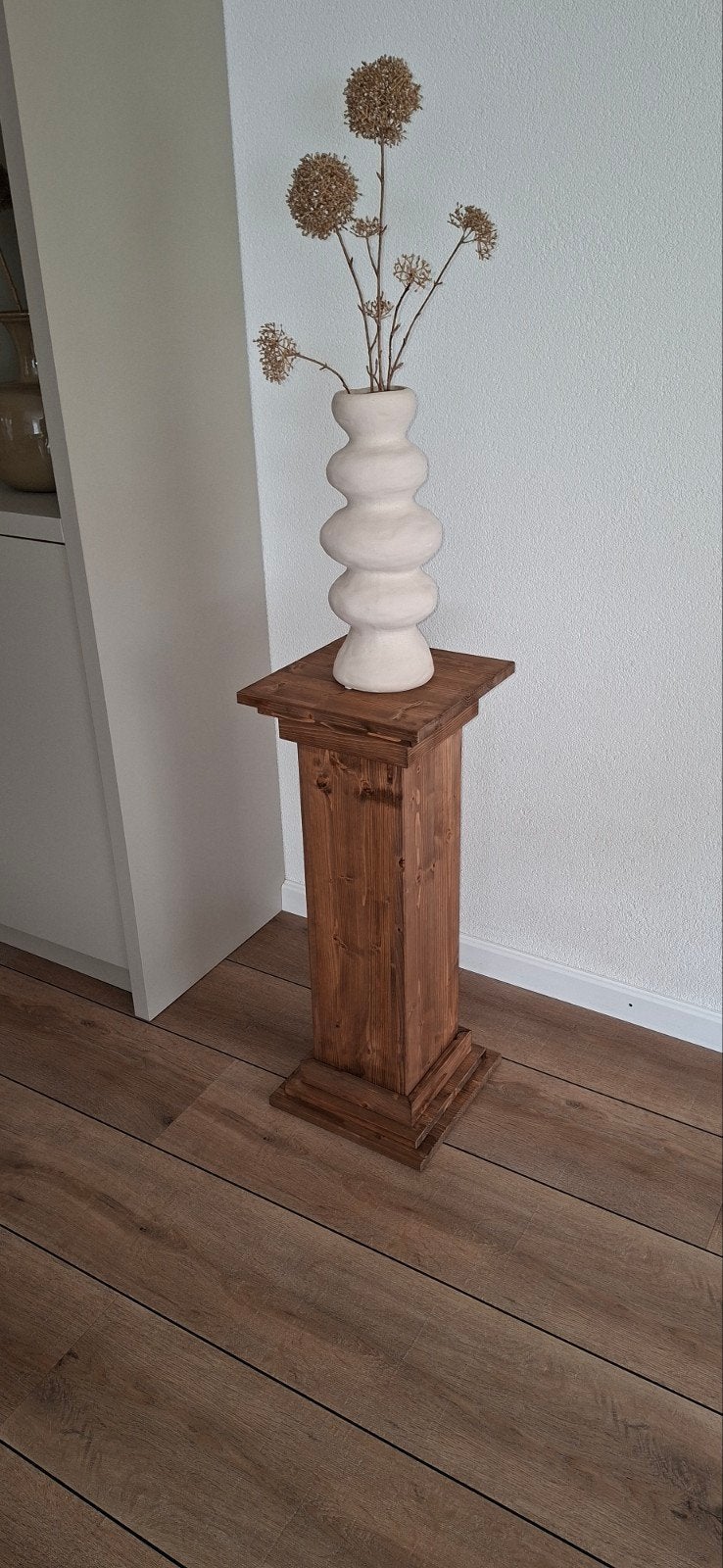 Decoratie zuil, Ophalen