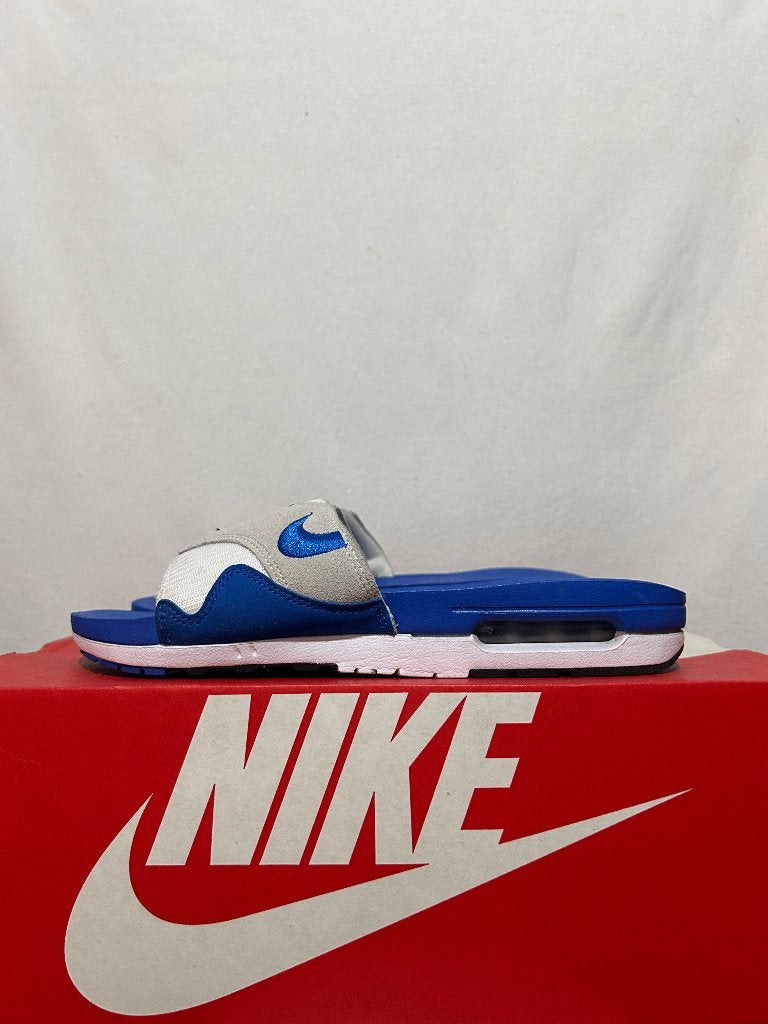 ALS NIEUW + DOOS! Maat 44 - Nike Air Max 1 Slide Royal Blue, Slippers, Nike, Zo goed als nieuw, Nike