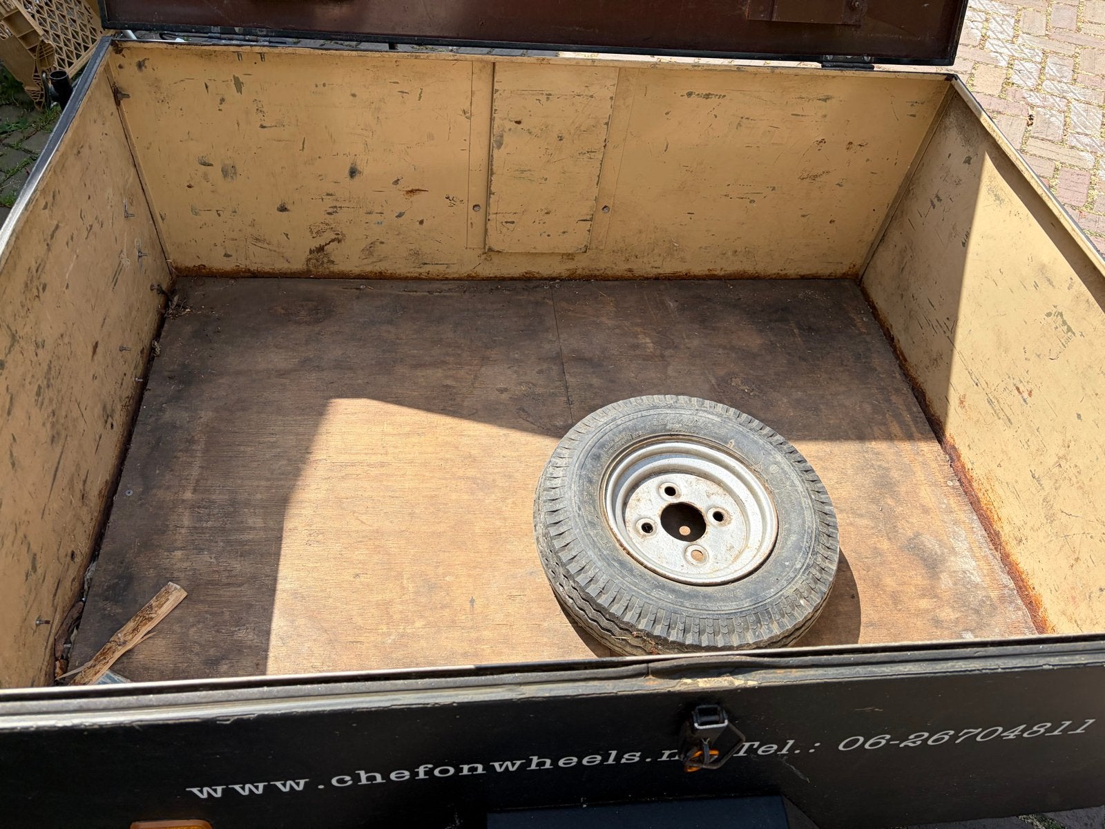 Aanhangwagen met reservewiel, Ophalen, Gebruikt