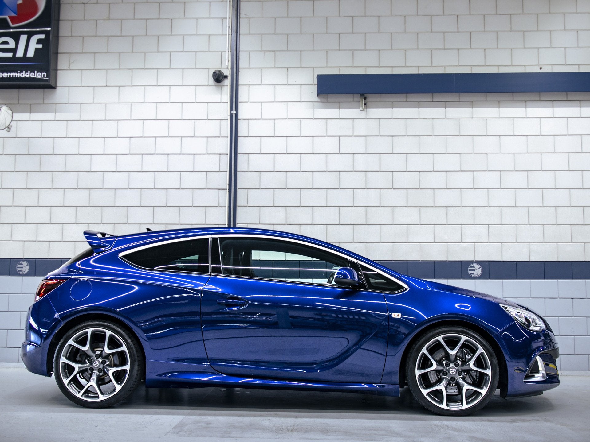 Opel Astra GTC 2.0 Turbo OPC (bj 2013), Auto's, Gebruikt, 4 cilinders, Blauw, Leder