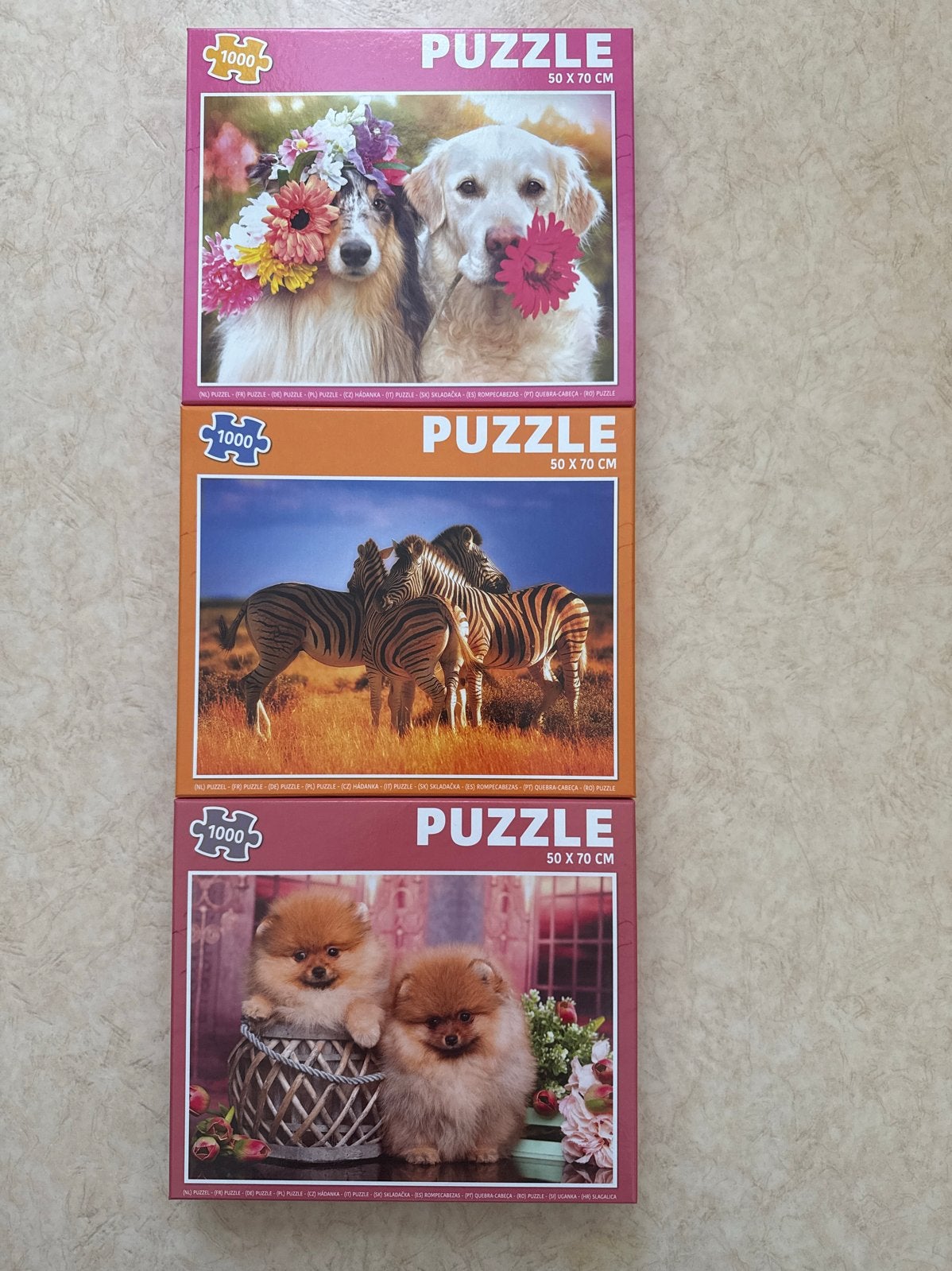 3x Legpuzzel 1000 stukjes: Honden & Zebra's (50x70 cm), Ophalen of Verzenden, 500 t/m 1500 stukjes, Zo goed als nieuw, Legpuzzel