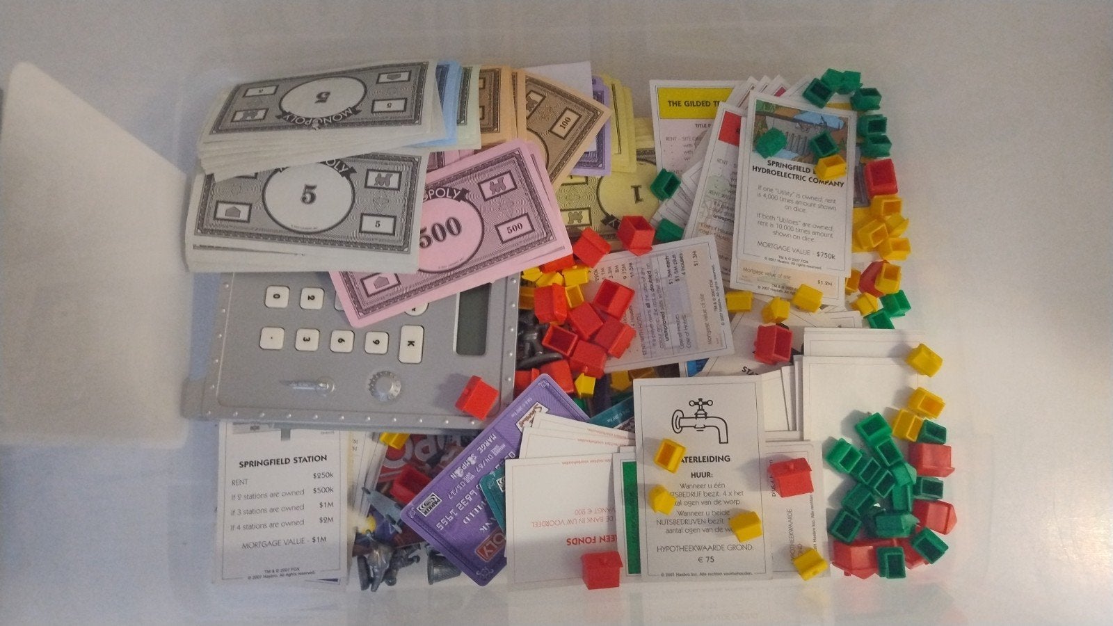 Grote partij Monopoly & The Simpsons Monopoly speelstukken, Hobby en Vrije tijd, Drie of vier spelers, Ophalen of Verzenden, Gebruikt