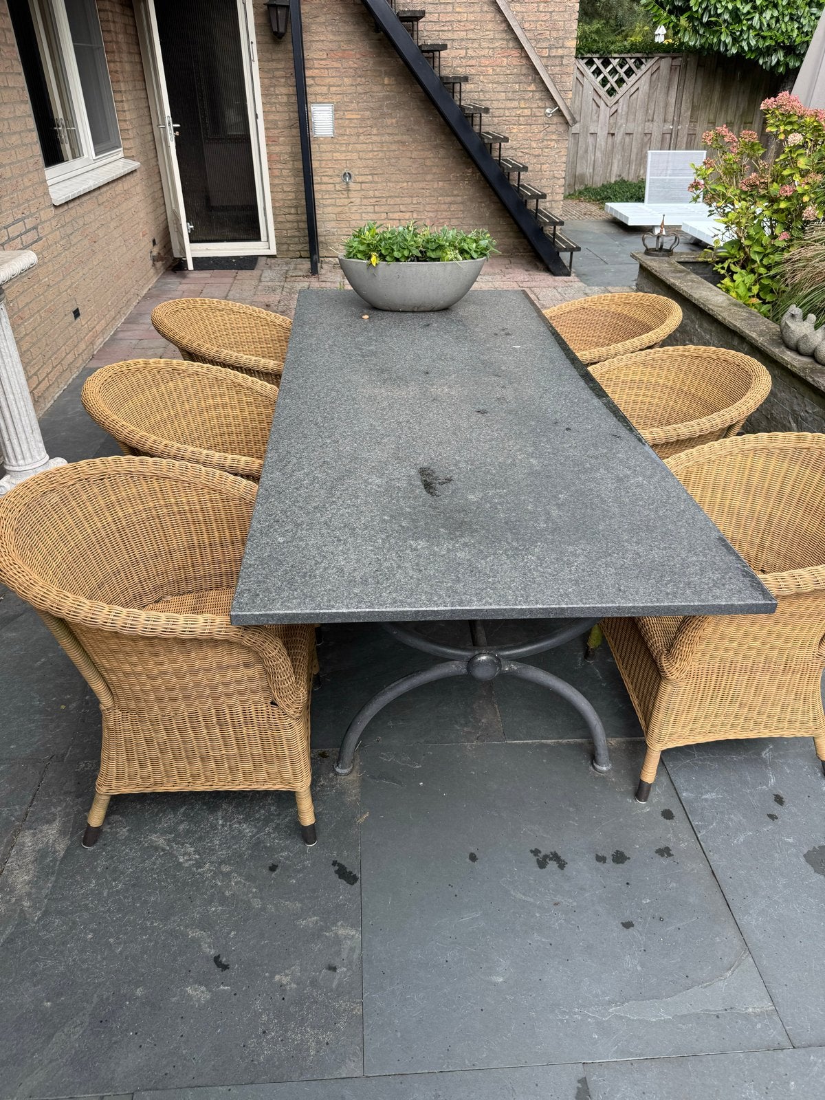 Complete tuinset met 6 rotan stoelen en granieten tafel, Ophalen, Gebruikt, Eettafel, Rotan