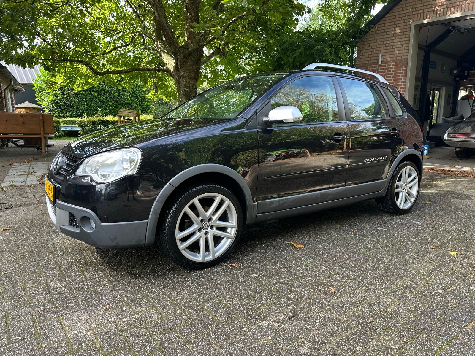 Volkswagen Polo 1.4 59KW 5D Cross AUT 2009 Zwart, Stof, 40 €/maand, Zwart, Grijs