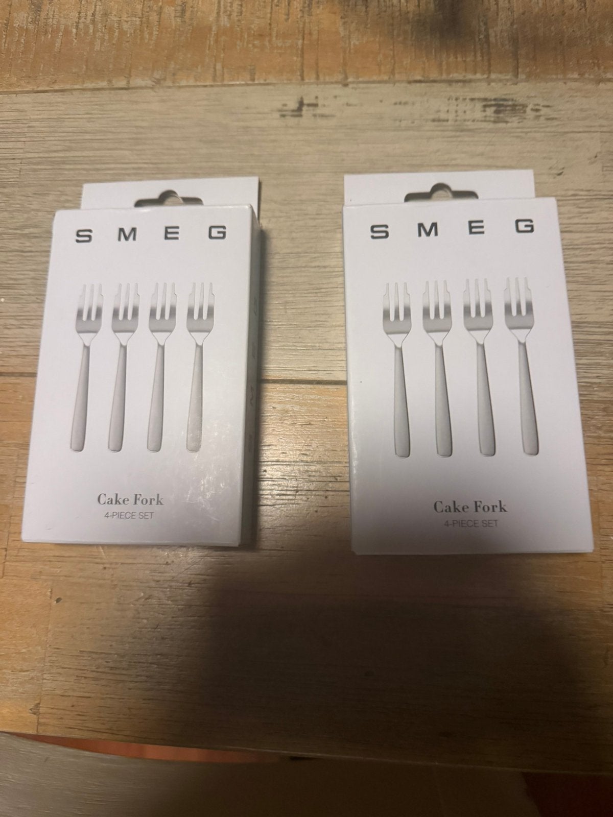 Twee doosjes met SMEG gebak vorkjes nieuw, Ophalen of Verzenden, Zo goed als nieuw, Rvs of Chroom