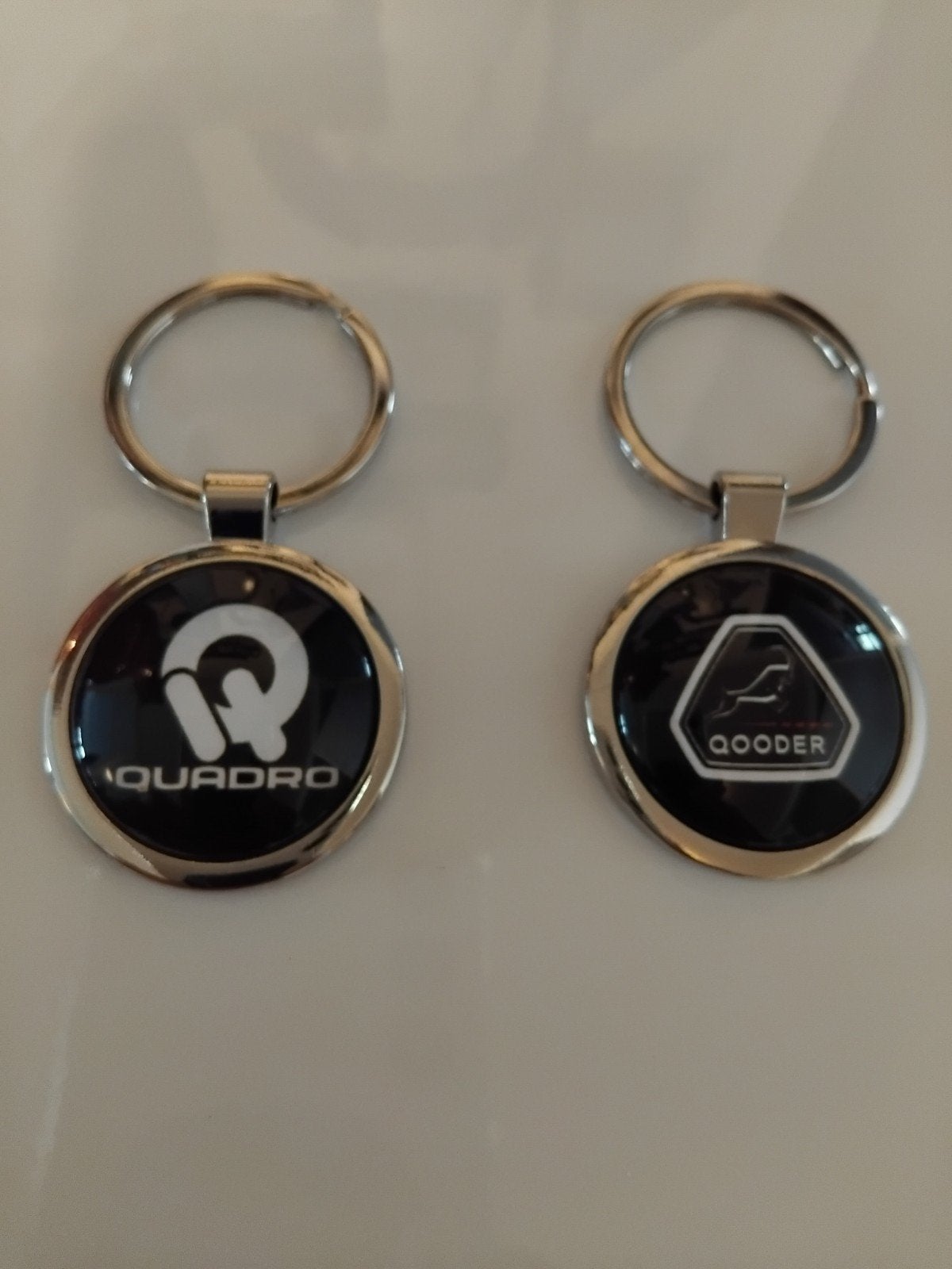 Quadro of Qooder Sleutelhanger, Ophalen of Verzenden, Nieuw, Transport