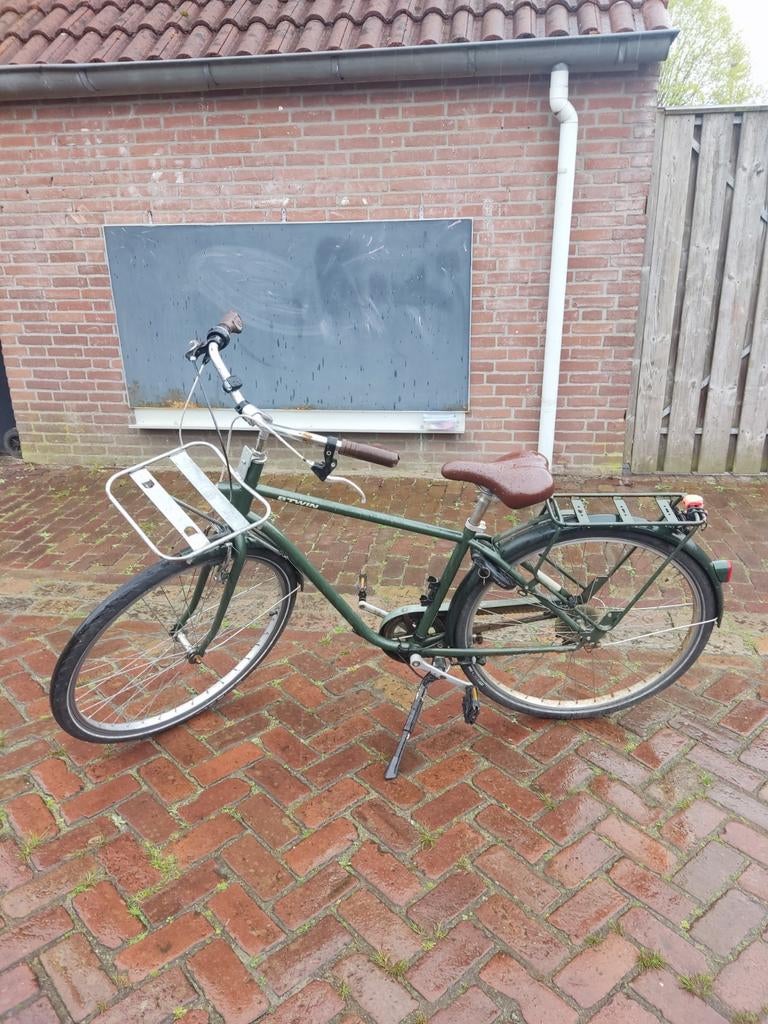 Groene tienerfiets met voordrager, Ophalen