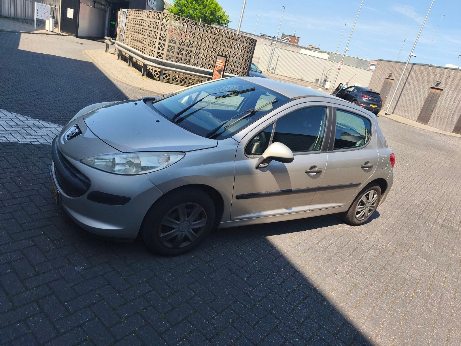 Goed onderhouden Peugeot 207 1.4 16V 5DRS 2006 Grijs, Auto's, Voorwielaandrijving, Stof, 1360 cc, Zwart