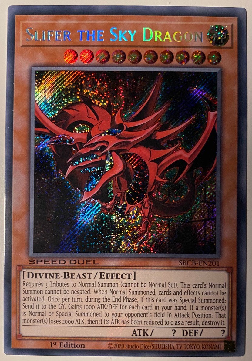 Yu-Gi-Oh! Slifer the Sky Dragon SBCB 1st Edition !, Ophalen of Verzenden, Zo goed als nieuw, Meerdere kaarten, Foil