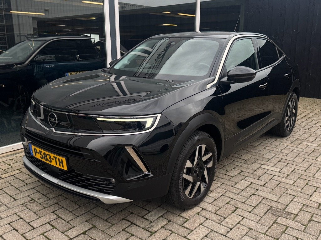 Opel Mokka 1.2 Turbo BUSINESS ELEGANCE | LEER | CAMERA |TREK, Auto's, Voorwielaandrijving, 1199 cc, 620 kg, Zwart