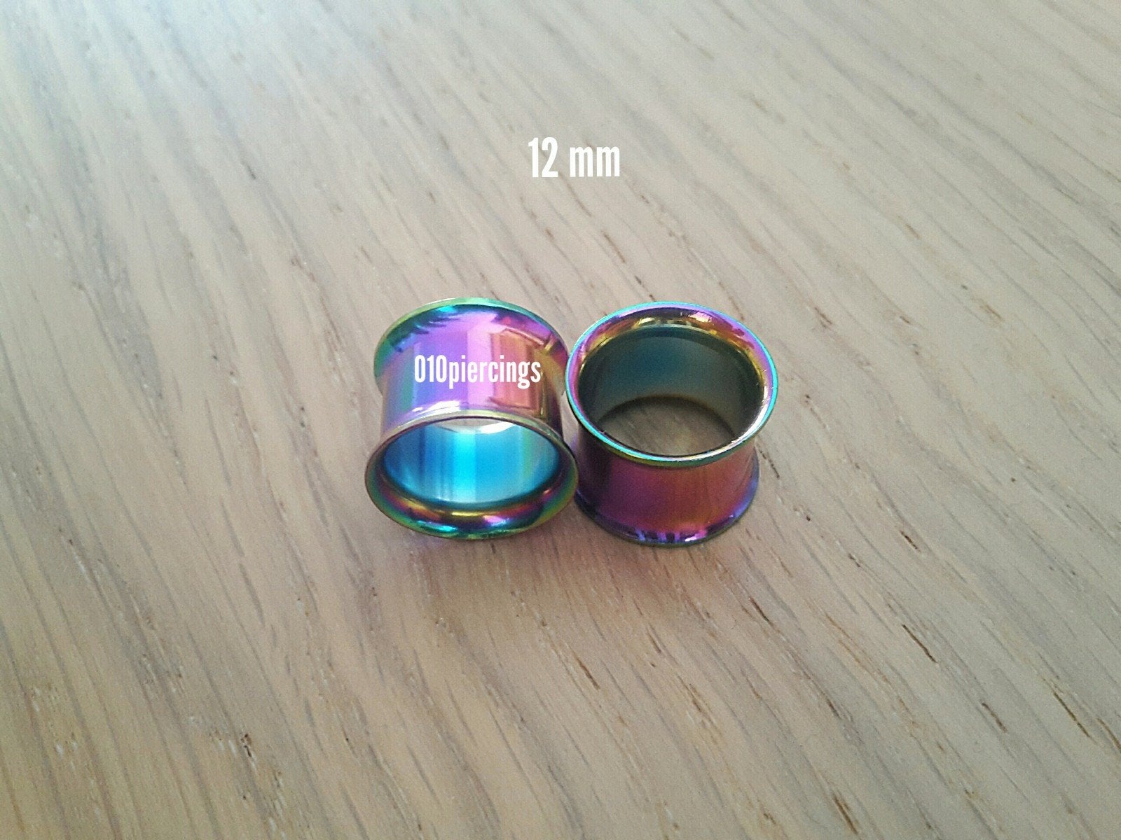 Nieuwe tunnels. Staal. Regenboog. 5, 6, 8, 12, 14, 16 mm., Ophalen of Verzenden, Zo goed als nieuw, Staal, Oor- of Traguspiercing