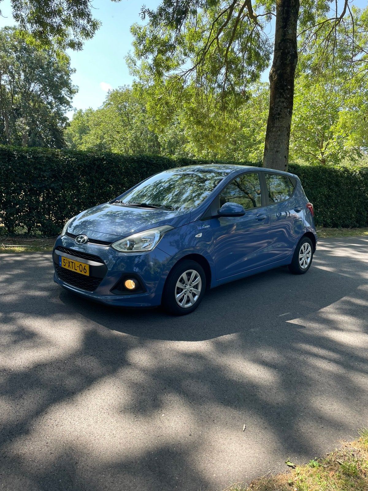 Hyundai i10 bleu 1.0 5DR 2014 clima/navi, Auto's, Stof, 31 €/maand, 23 km/l, Origineel Nederlands