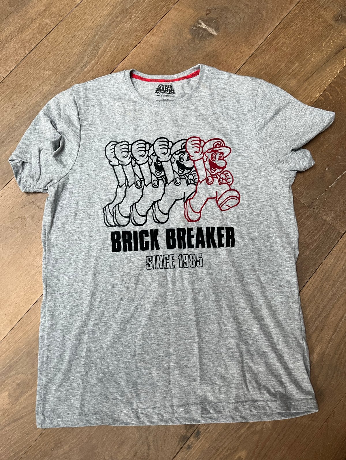 Super Mario Brick Breaker T-shirt - Maat XL, Ophalen of Verzenden, Zo goed als nieuw, Maat 56/58 (XL), Grijs