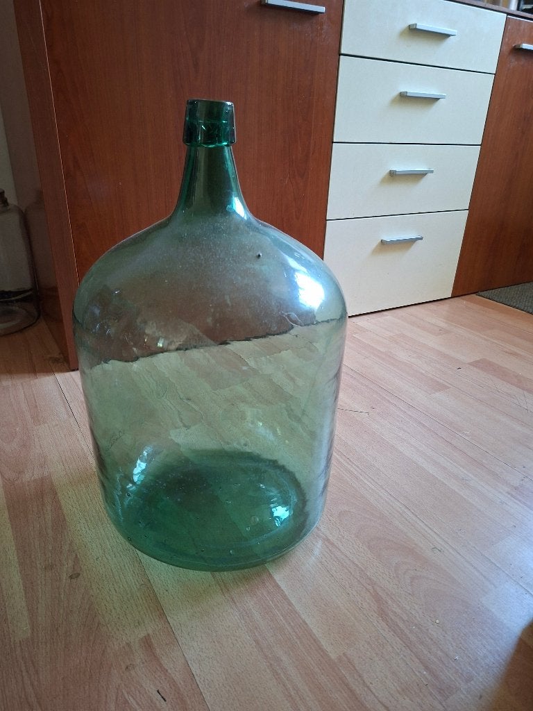 grote glazen fles, Ophalen
