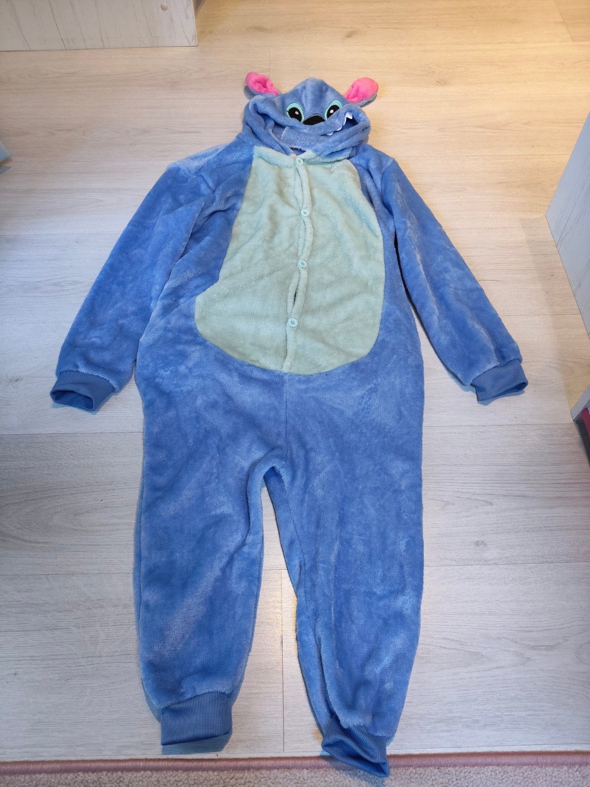 stitch onesie 140, Kinderen en Baby's, Ophalen of Verzenden, Zo goed als nieuw, Jongen of Meisje