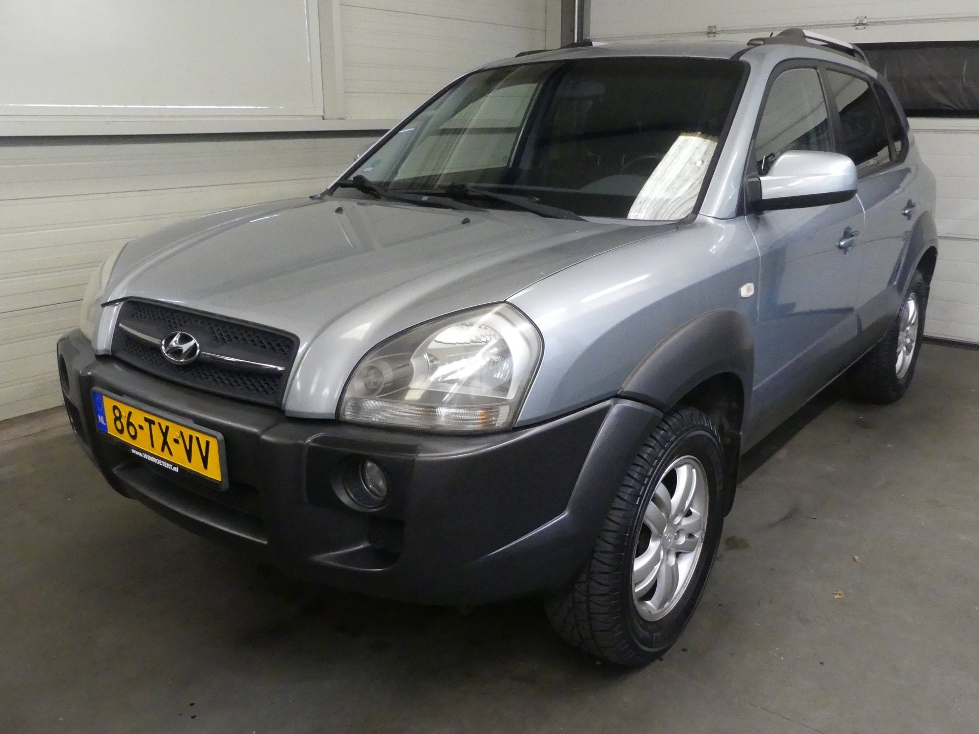 Hyundai Tucson 2.0i Style - Trekhaak - Airco, Auto's, Stof, Gebruikt, Zwart, 4 cilinders