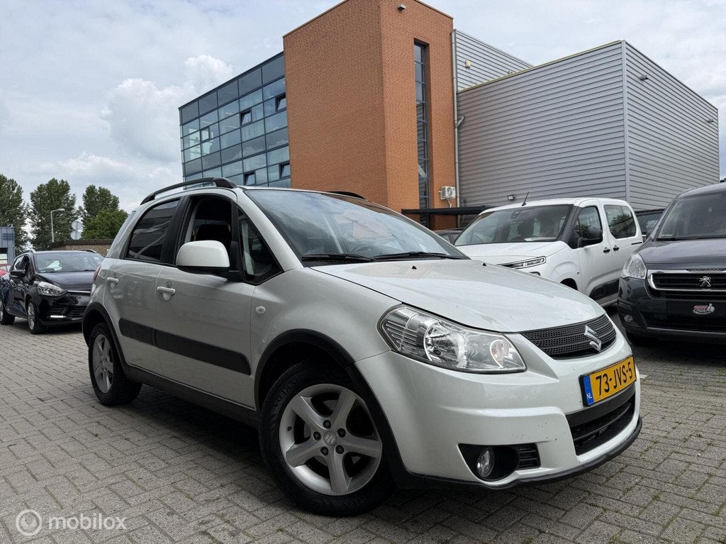 Suzuki SX4 1.6 Exclusive Parelmoer wit 1 jaar APK, 15 km/l, Gebruikt, 4 cilinders, Automatische klimaatregeling