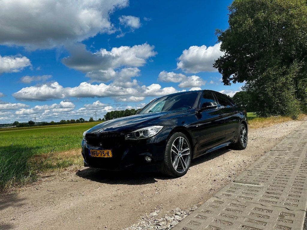 BMW 335i XDrive GT  High Executive M-Sport, Auto's, Automaat, Navigatiesysteem, Zwart, Leder
