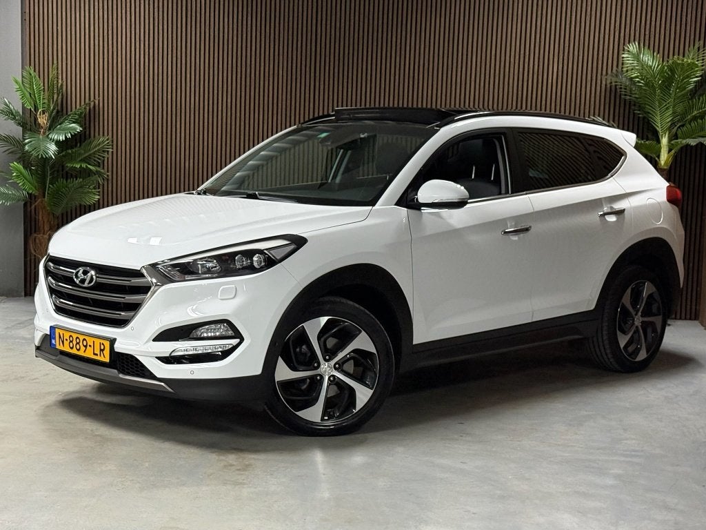Hyundai Tucson 1.6 T-GDi Prem. 4WD (bj 2016, automaat), Gebruikt, 4 cilinders, Wit, Leder
