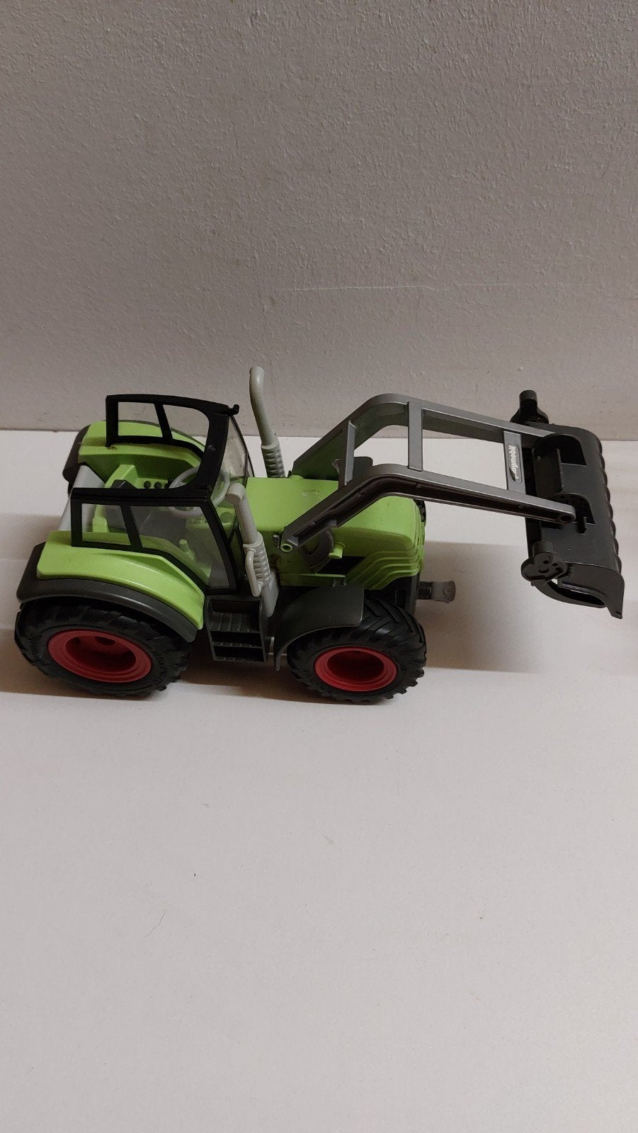 Groene speelgoedtractor met voorlader, Ophalen of Verzenden, Gebruikt
