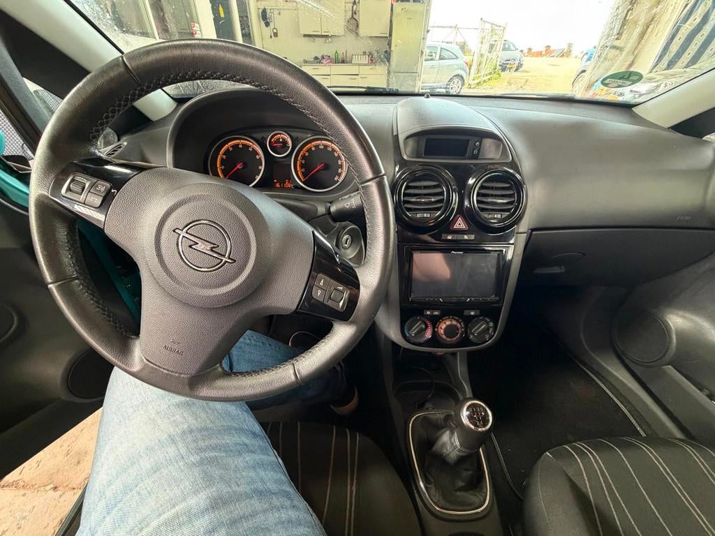 Opel Corsa 1.2-16V '111' Edition Airco Cruise-control Scherm, Auto's, Voorwielaandrijving, Euro 5, Navigatiesysteem, Blauw