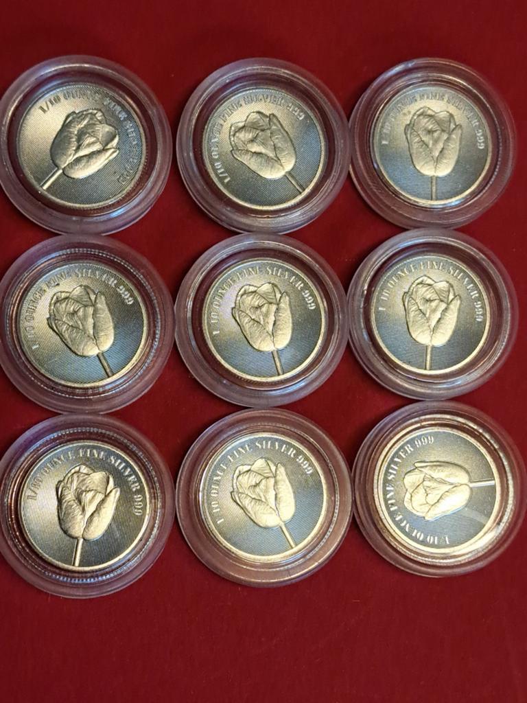 9x 1/10 zilveren tulp knm, Ophalen of Verzenden, Zilver