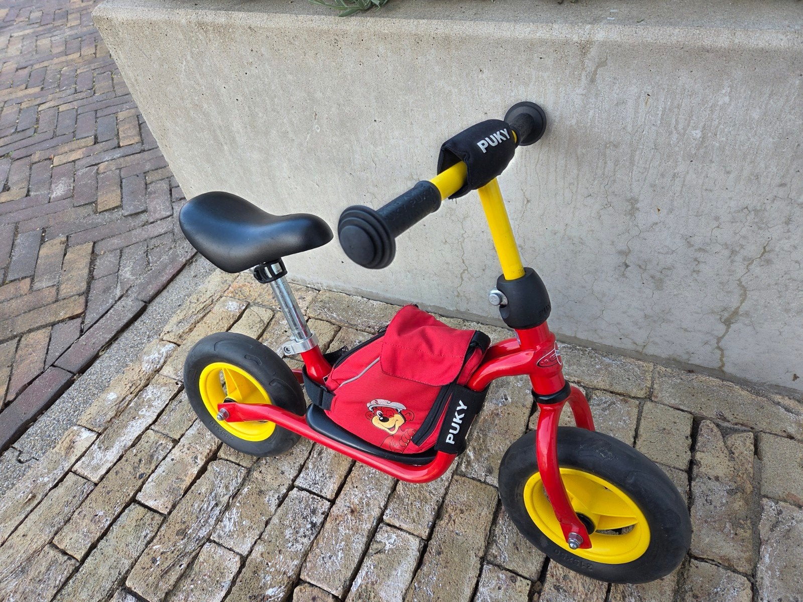 Puky loopfiets rood/geel met tas, vanaf 2 jaar, Kinderen en Baby's, Speelgoed | Buiten | Voertuigen en Loopfietsen, Ophalen, Gebruikt