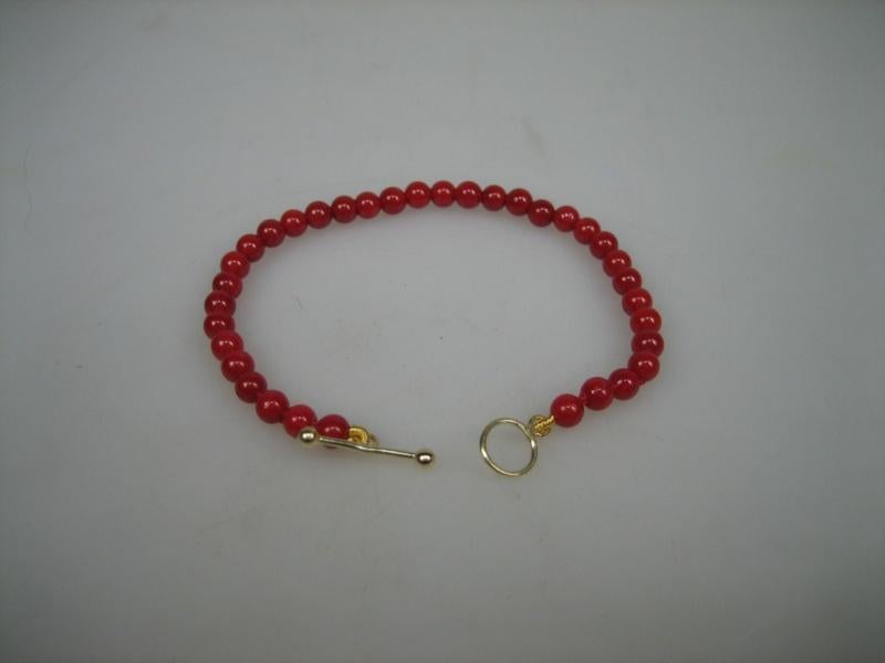 Antieke Bloedkoralen Baby Armbandje met Goud kapitteltokje, Verzenden, Nieuw, Goud, Armband