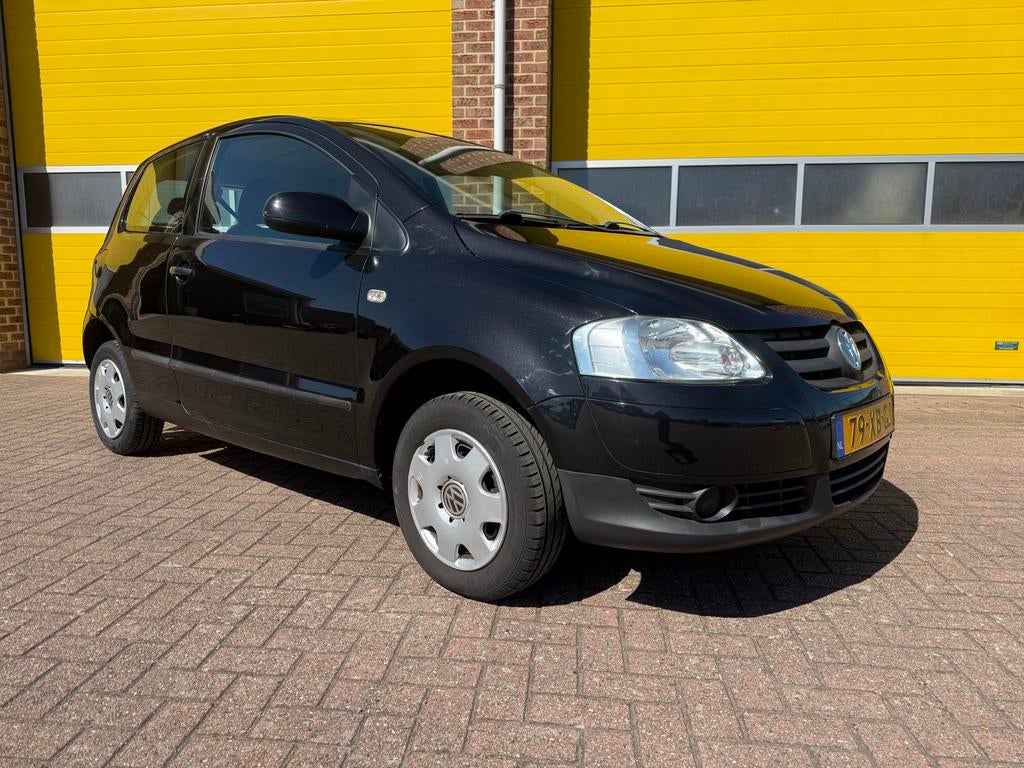Volkswagen Fox 1.2 40KW 2007 Zwart, Auto's, Voorwielaandrijving, Stof, Airbags, 4 stoelen
