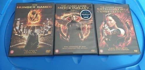 Te koop dvds Hunger games , mockinjay 1 ,catching fire, Vanaf 12 jaar, Ophalen of Verzenden, Zo goed als nieuw, Actie