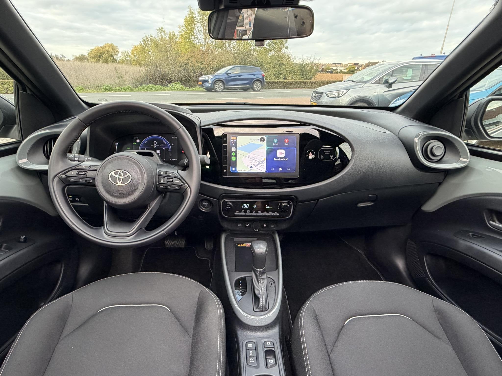 Toyota Aygo X Hybrid 115 envy CABRIO | NAVI | KLIMA | BOVAG, 12 maanden, Stof, Gebruikt, Euro 6