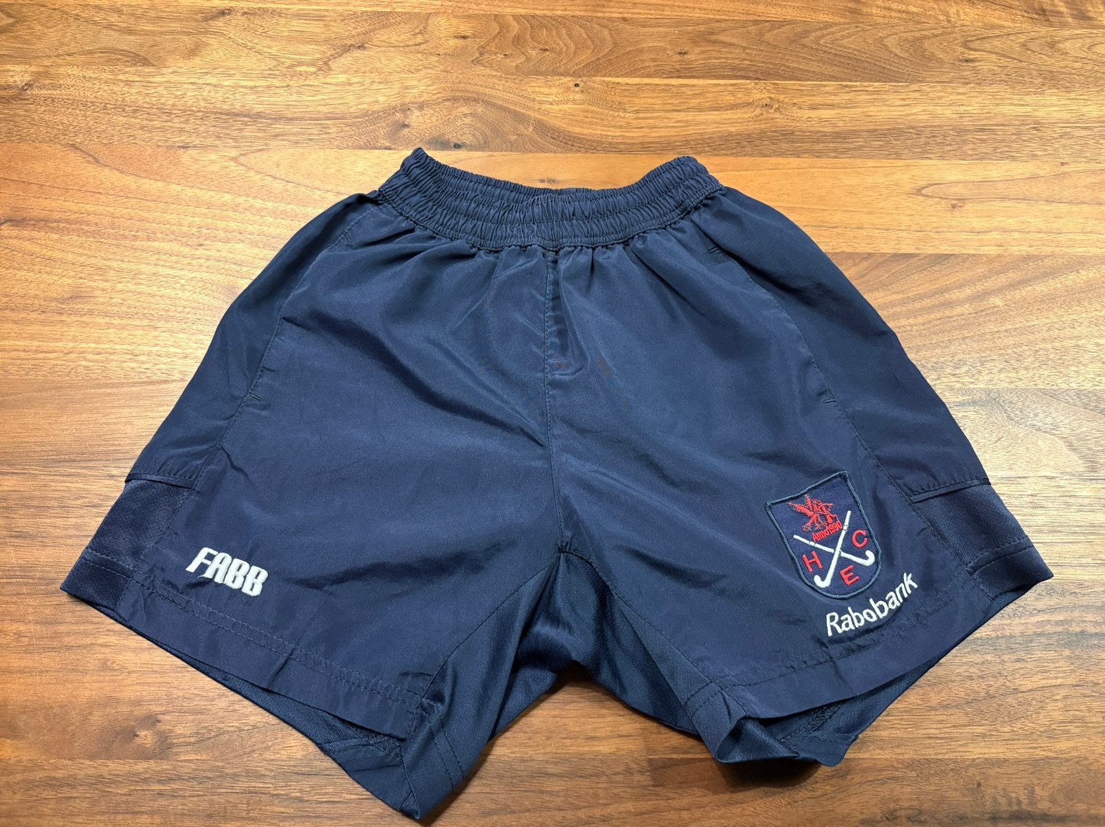 HCE wedstrijdshort maat 128, Ophalen of Verzenden, Gebruikt, Jongen of Meisje, Sport- of Zwemkleding