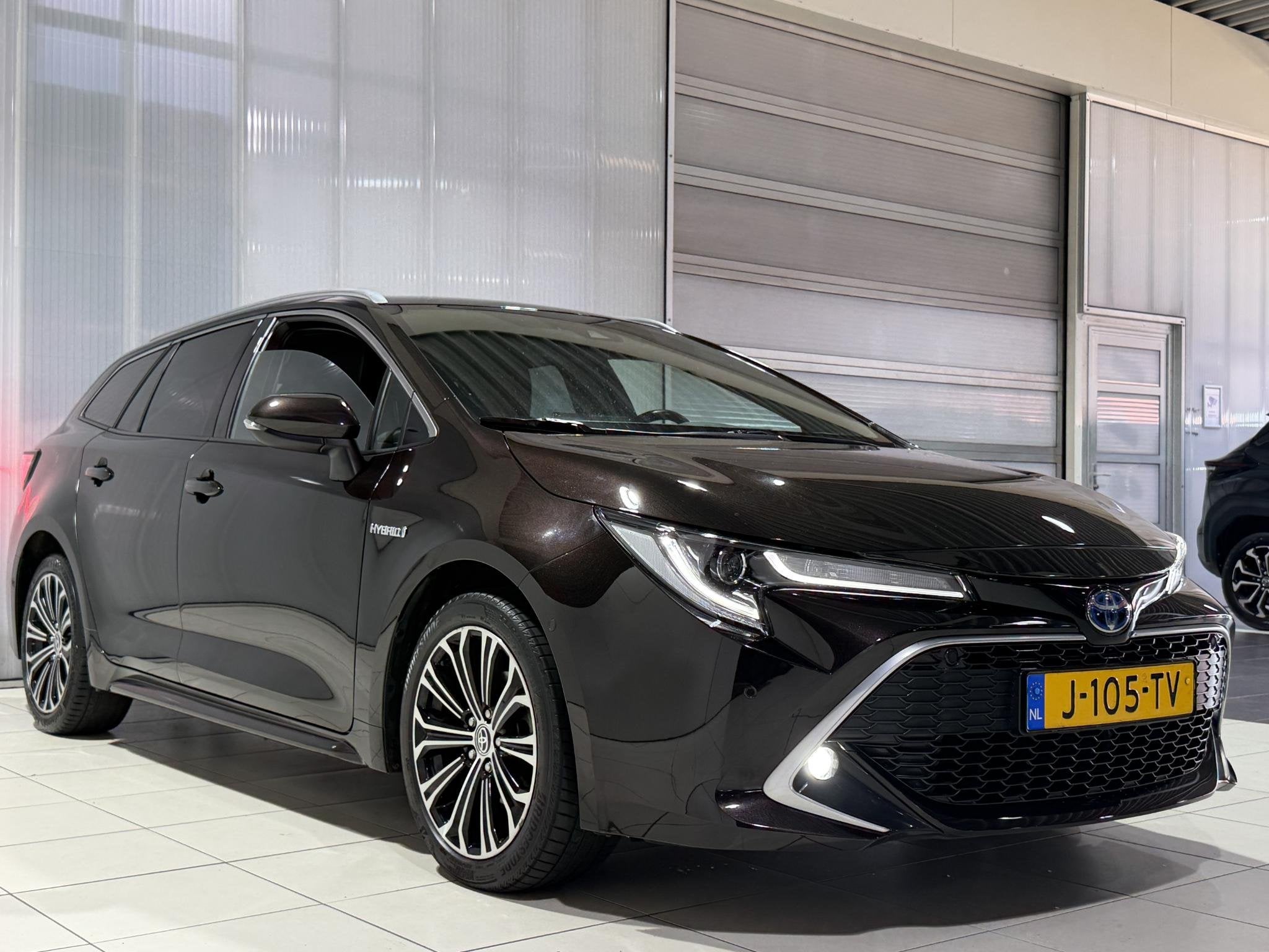 Toyota Corolla Touring Sports 1.8 Hybrid Executive Trekhaak, Auto's, Gebruikt, 4 cilinders, Bruin, Corolla