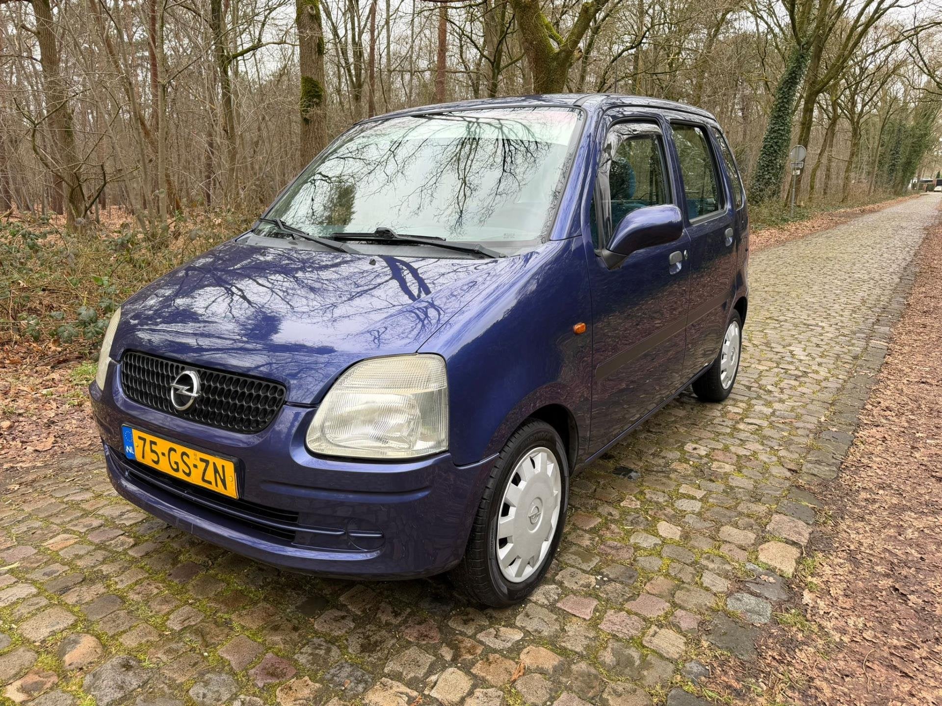 Opel Agila 1.2-16V Comfort, Auto's, Voorwielaandrijving, Gebruikt, 31 €/maand, Blauw