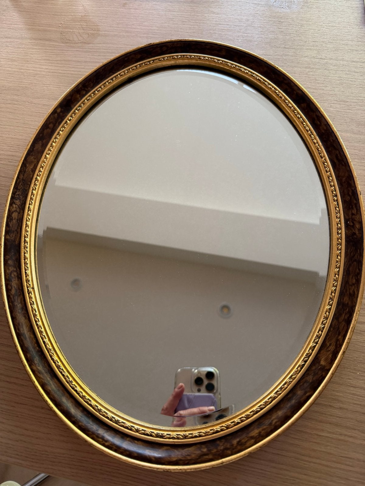 Ovale spiegel met gouden en donkerbruine lijst, Ophalen of Verzenden, Ovaal, Minder dan 50 cm, Minder dan 100 cm
