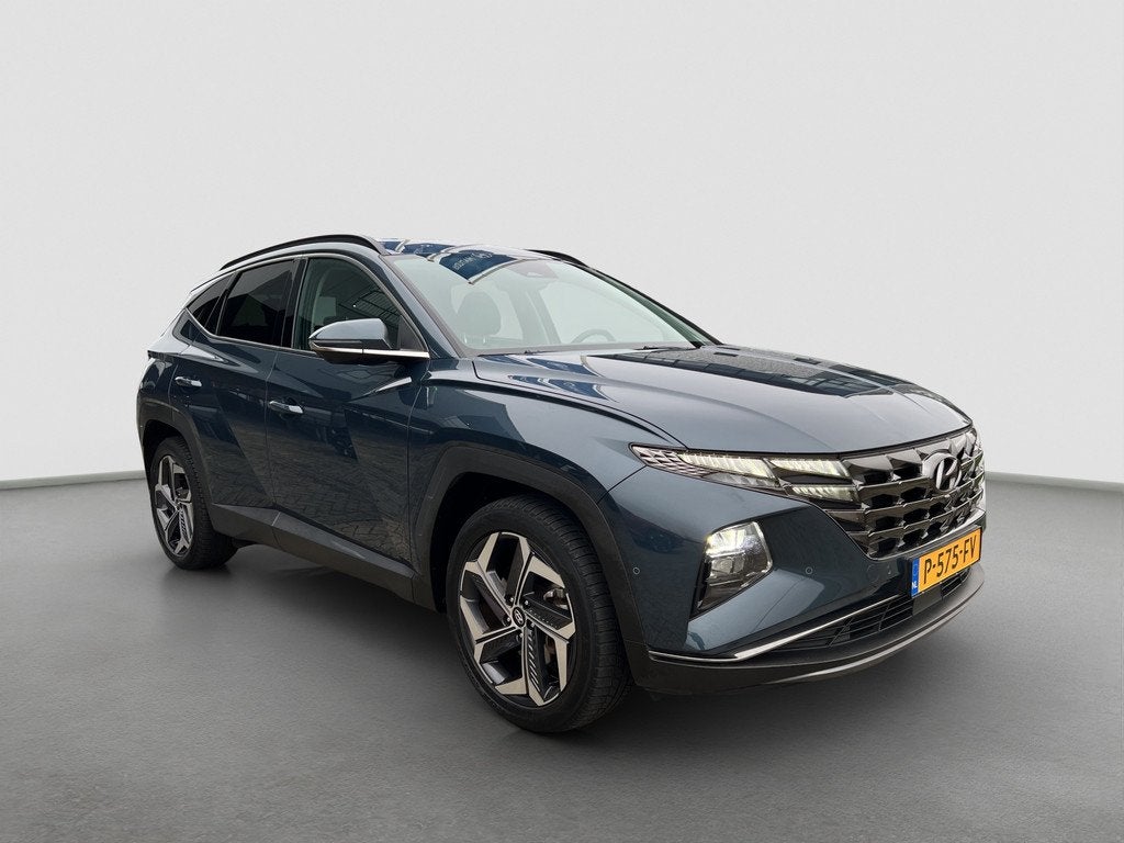 Hyundai Tucson 1.6 T-GDI 265pk PHEV Premium 4WD, Gebruikt, 4 cilinders, Blauw, Bedrijf