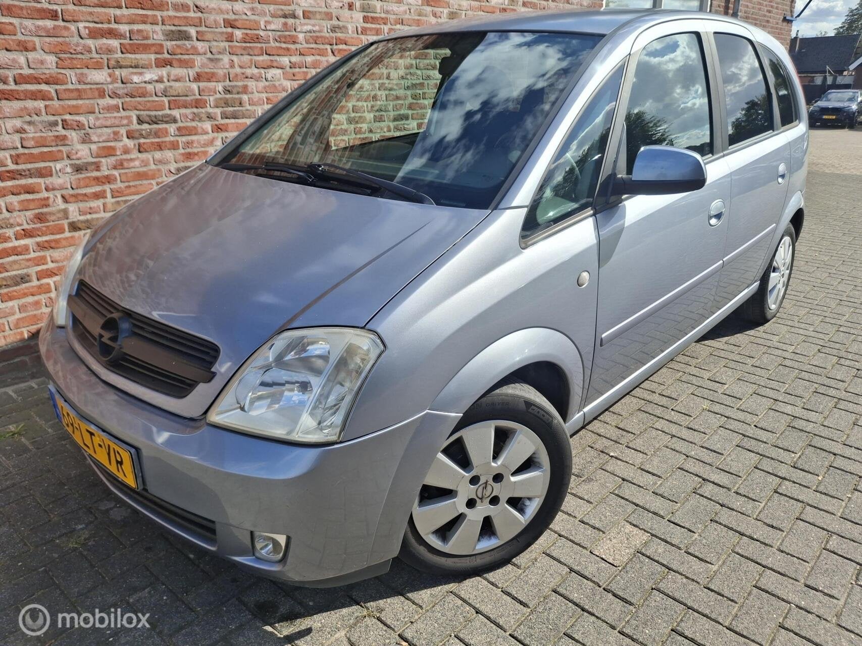 Opel Meriva 1.6 Cosmo, Auto's, Gebruikt, 4 cilinders, Met garantie (alle), Origineel Nederlands