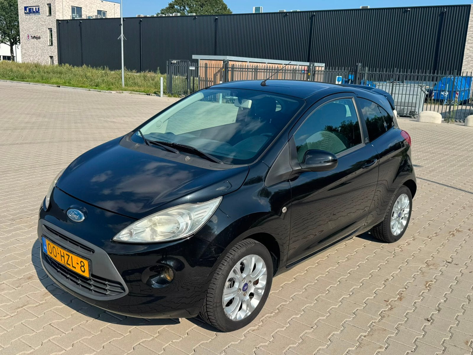 Ford Ka 1.2 51KW 2009 Zwart, Auto's, Voorwielaandrijving, Euro 5, Stof, 4 cilinders