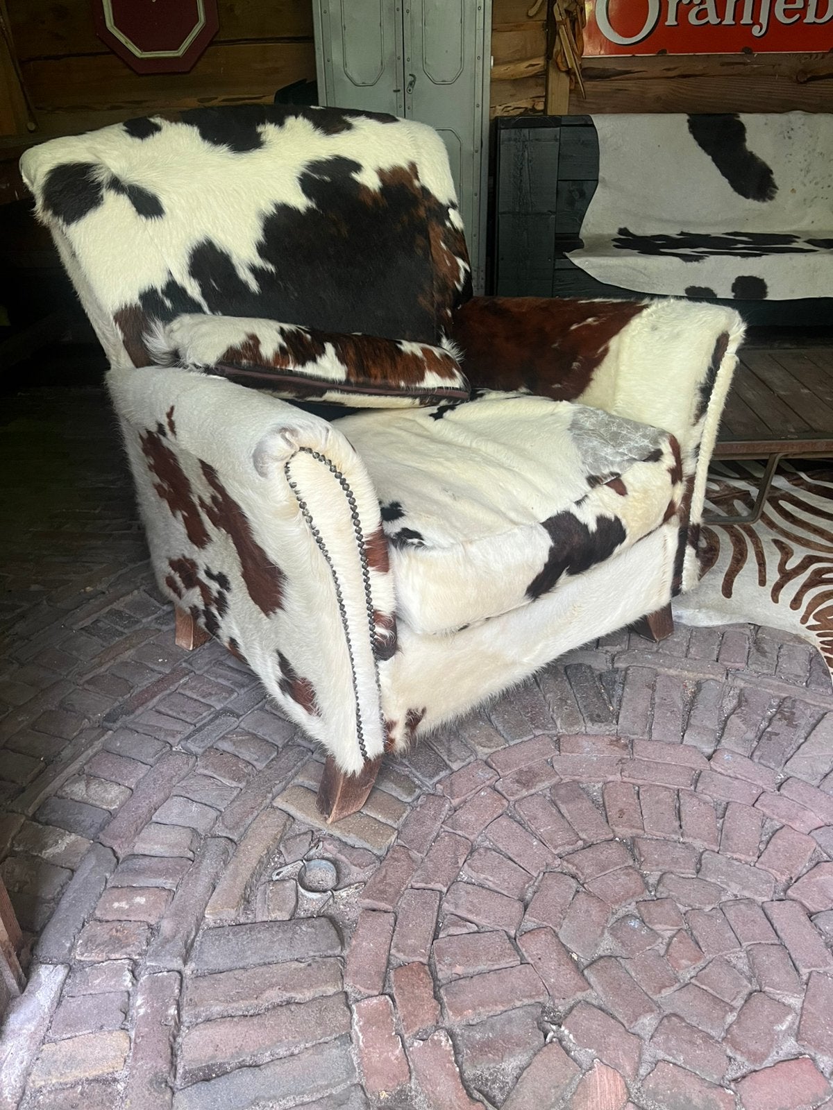 Koeien huid stoel. Fauteuil. Bruinrood - wit., Huis en Inrichting, Ophalen, Zo goed als nieuw, 75 tot 100 cm